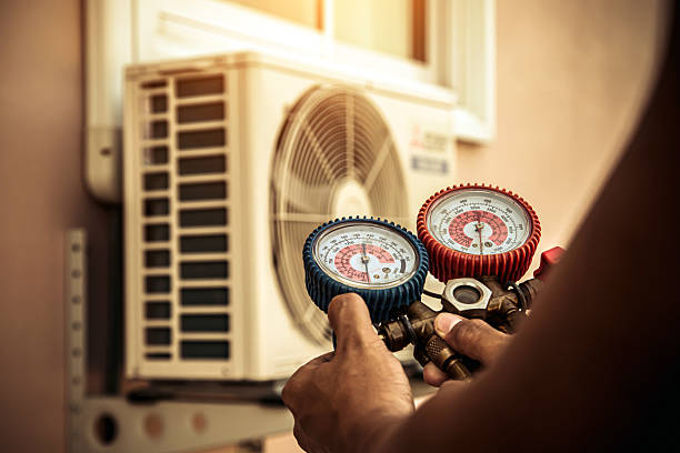 Professional Heat Pump Repair technician working in Washington Grove, MD